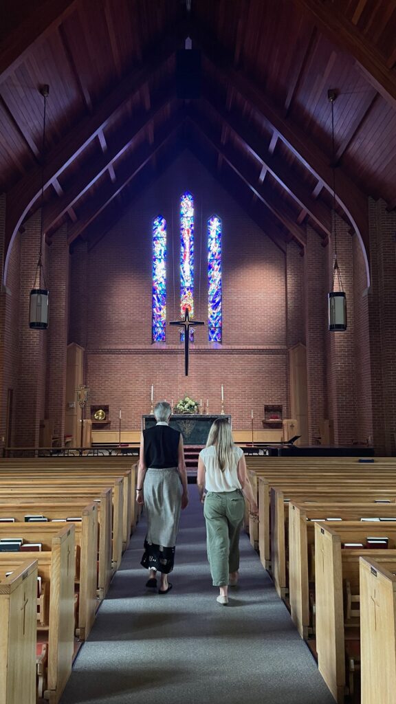 Stained glass above the altar at Church of the Mediator was crafted by a Latvian refugee. (Photo by Kabir Burman.)